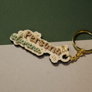 Llavero Persona Vitamina Cuqueta